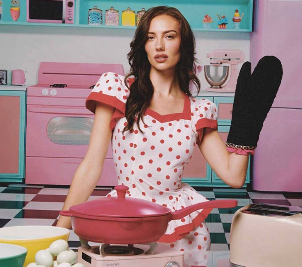 A collection of Lynnee Valentine's Day gifts including the leopard print apron, pink baking spatula, and a pink ceramic skillet for home cooks.